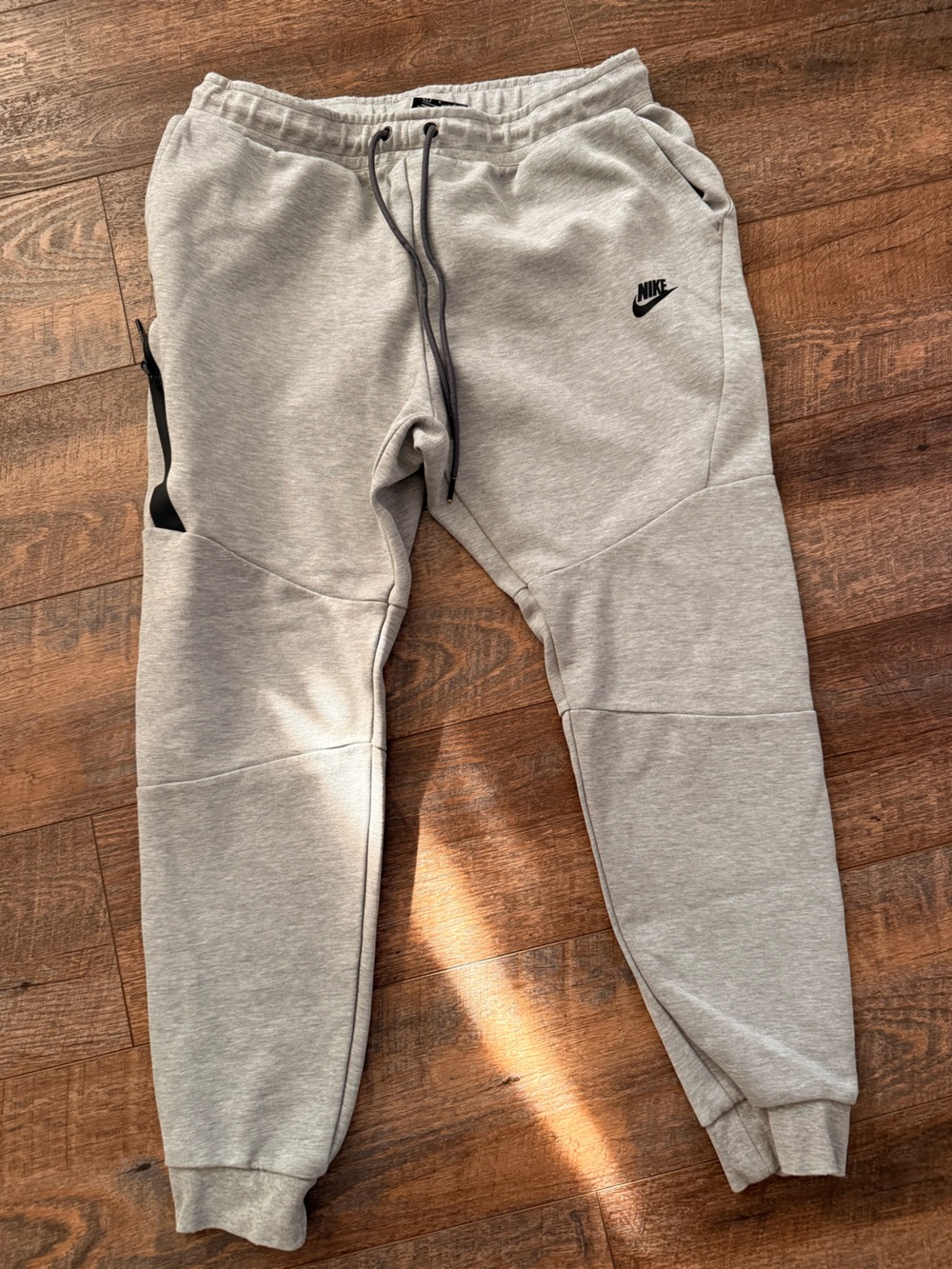 Nike Men’s Heather Gray Fleece Joggers with Black Logo